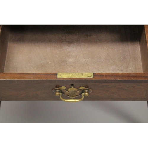 1043 - A GEORGE III DESIGN WALNUT LOW BOY, with a central drawer flanked by a pair of deep drawers on cabri... 