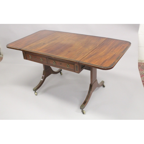 1051 - A REGENCY MAHOGANY AND ROSEWOOD BANDED SOFA TABLE, with a pair of small frieze drawers, dummy drawer... 