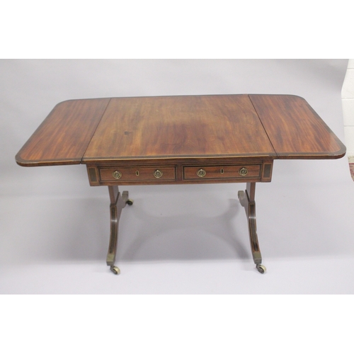 1051 - A REGENCY MAHOGANY AND ROSEWOOD BANDED SOFA TABLE, with a pair of small frieze drawers, dummy drawer... 