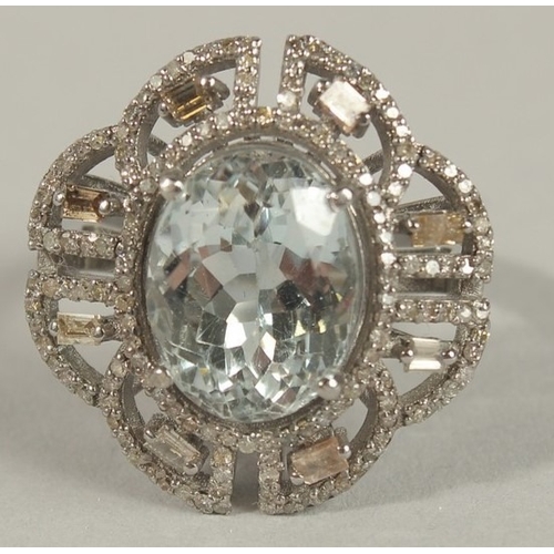 1661 - AN ORNATE DRESS RING in silver, set with an oval aquamarine surrounded by baguette and R/C diamonds ... 