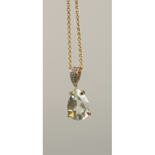 1662 - A 9CT YELLOW GOLD PENDANT set with pear shaped green amethyst and a diamond set bale on a gold-plate... 