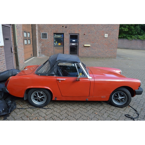 1 - An MG Midget 1500 convertable, registration no: GBW 486S.