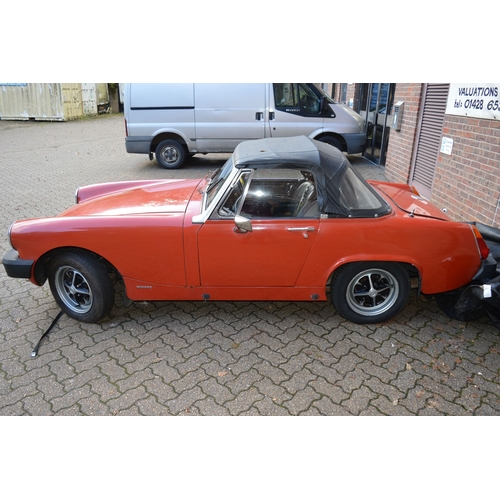 1 - An MG Midget 1500 convertable, registration no: GBW 486S.