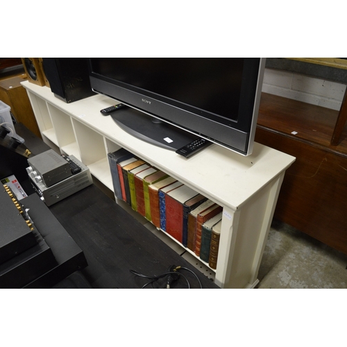 210 - A white painted book shelf.