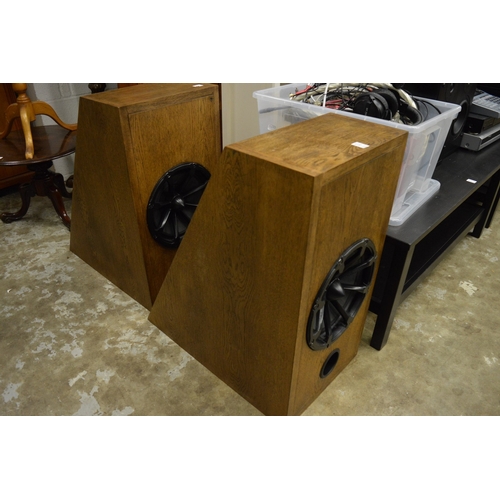 212 - A pair of large floor standing speakers and three other pairs of speakers.