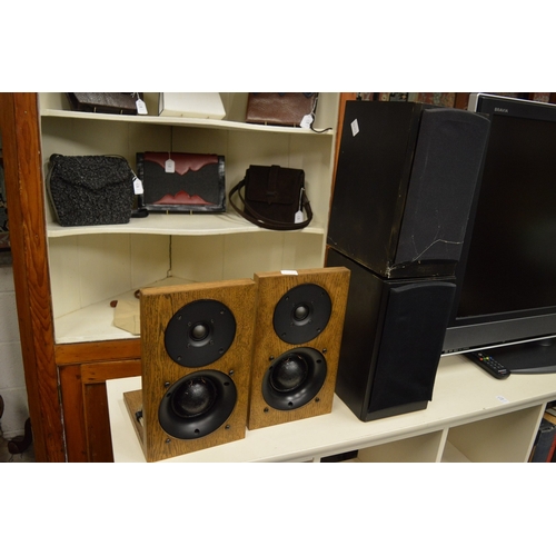 212 - A pair of large floor standing speakers and three other pairs of speakers.