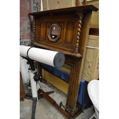 217 - An oak over mantel mirror/fire surround together with a similar fender.