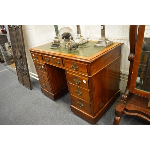 240 - An oak twin pedestal desk.