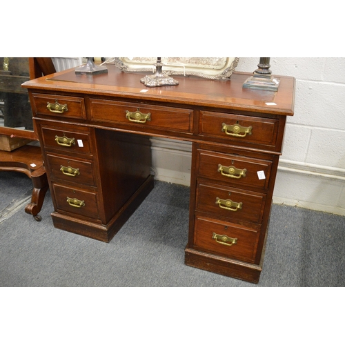 242 - A Victorian walnut twin pedestal desk.