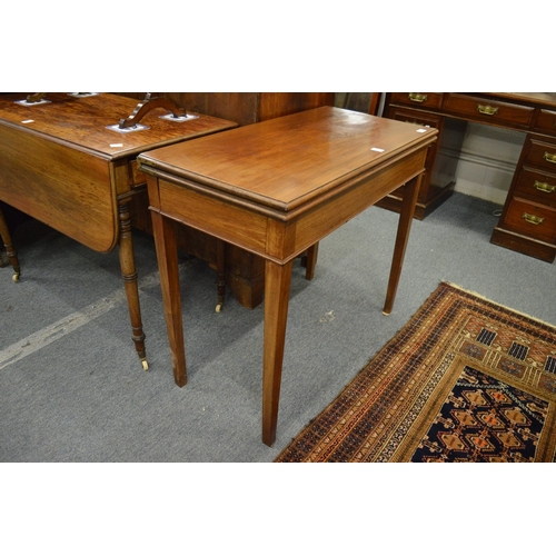 243 - A 19th century mahogany rectangular fold-over tea table.