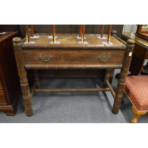 256 - An unusual oak 'Turners' single drawer side table.