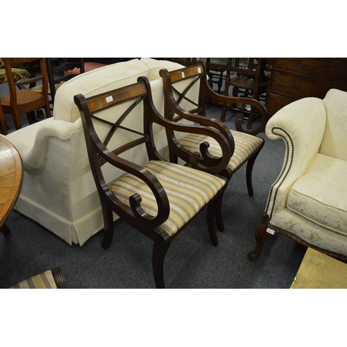 275 - A set of six Regency style mahogany dining chairs, two with arms.