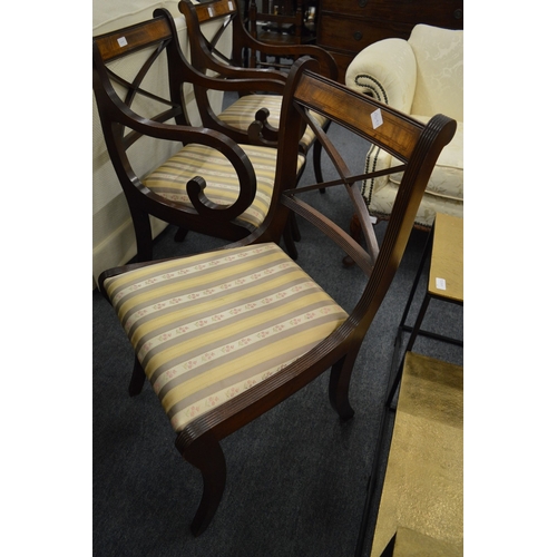 275 - A set of six Regency style mahogany dining chairs, two with arms.