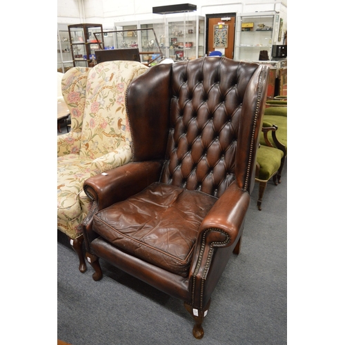 278 - Georgian design leather upholstered wing armchair.