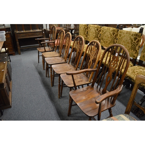 284 - A set of six Old Charm wheel back dining chairs, two with arms.