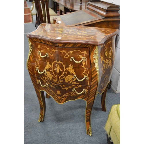 292 - A French style marquetry inlaid bombe three drawer petit commode.