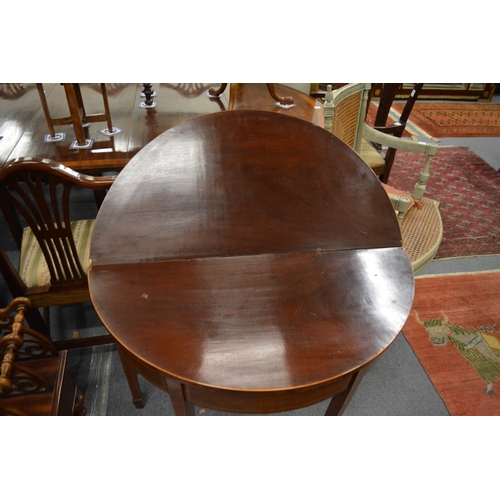 303 - A 19th century mahogany demi lune fold-over tea table.