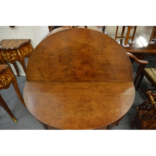 305 - A 19th century mahogany demi lune fold-over tea table.