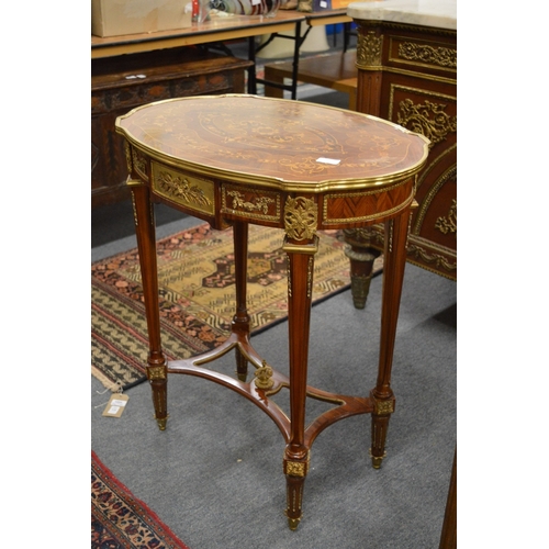 307 - A good pair of French style kingwood ormolu and marquetry inlaid oval occasional tables.