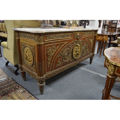 309 - A very good mahogany and ormolu mounted marble top commode of large size.