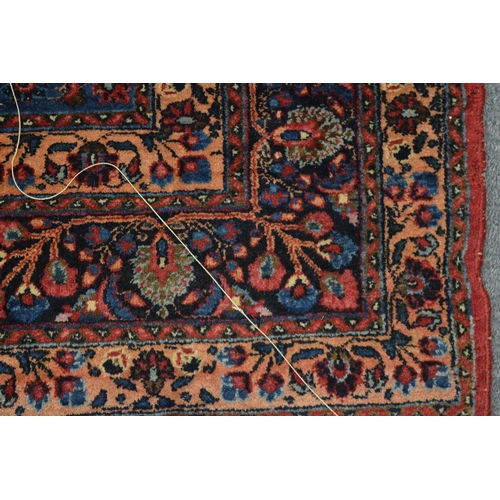 317 - A good Persian rug, 202cm x 139cm.