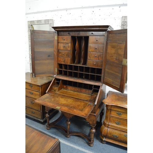 362 - A good 18th century walnut bureau cabinet on stand with a pair of mirrored doors enclosing a fitted ... 