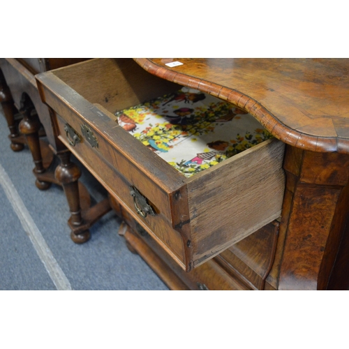 363 - A good 18th century Dutch walnut commode of bombay form with three drawers on bun feet.