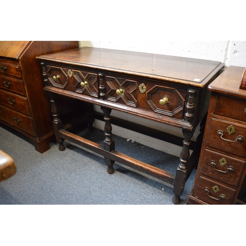 379 - An 18th century style oak two drawer dresser of small size.