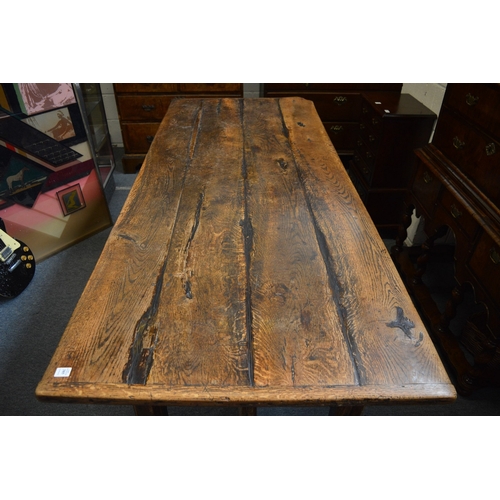 385 - A good 18th century oak refectory dining table.