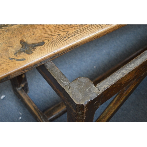 385 - A good 18th century oak refectory dining table.