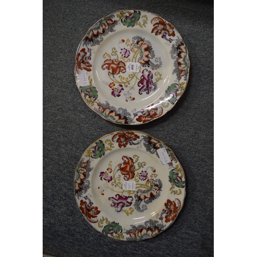 495 - A pair of floral decorated iron stone plates.