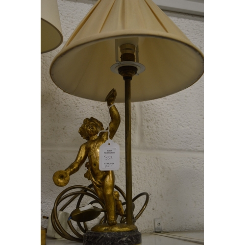 532 - A pair of gilt bronze cherub table lamps.