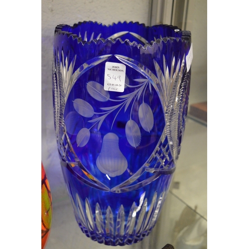 549 - A pair of large Bohemian blue tinted cut glass vases.