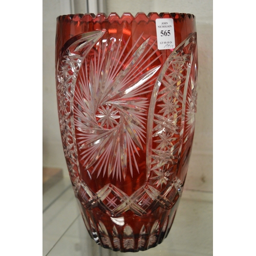 565 - A large pair of Bohemian ruby tinted cut glass vases.