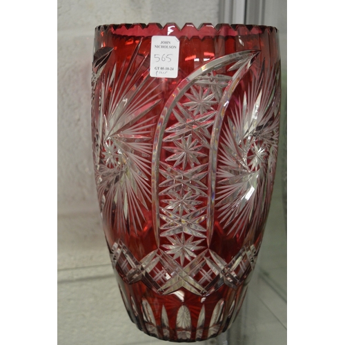 565 - A large pair of Bohemian ruby tinted cut glass vases.