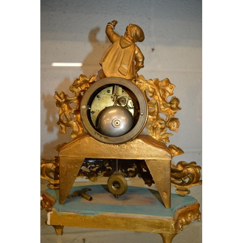 566 - A French ormolu mantel clock and stand.