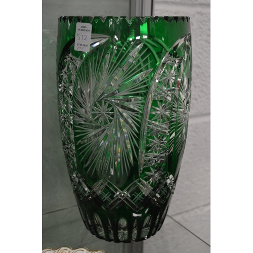 572 - A large pair of Bohemian green tinted cut glass vases.