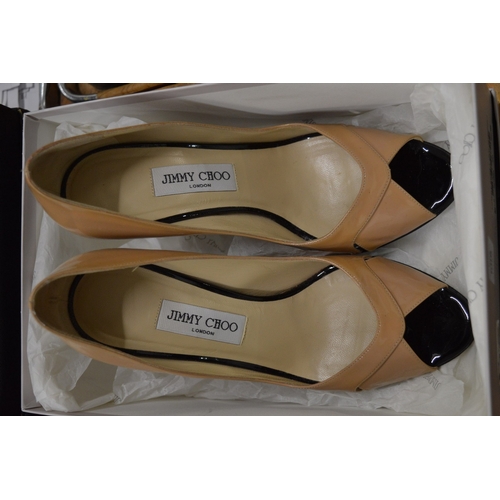 608 - A pair of Jimmy Choo ladies beige patent leather high heel shoes, with original box, size 39.