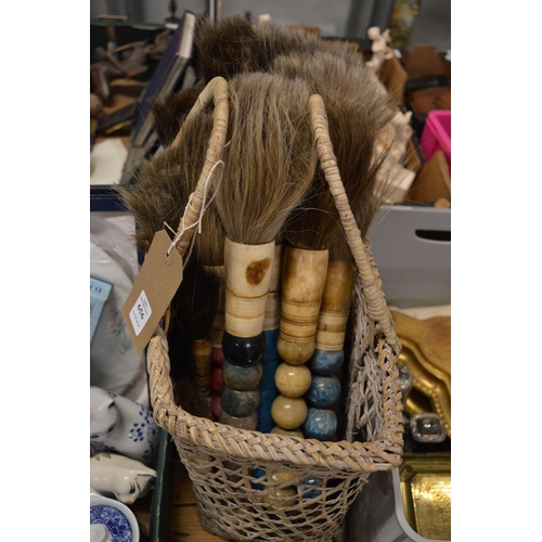 656 - Basket containing a large collection of Chinese brushes.