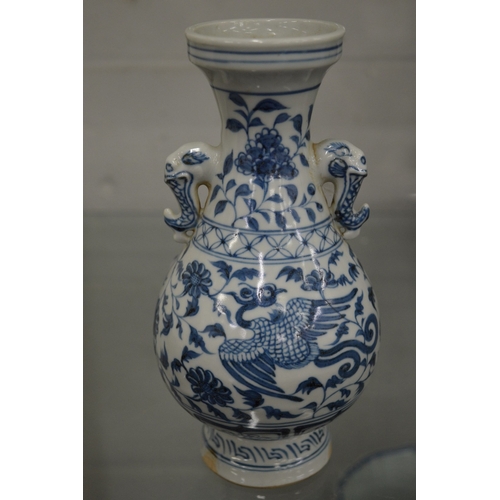 672 - A Chinese blue and white small twin handled vase.