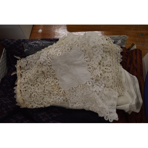 699 - A quantity of Honiton and other lace, Ikat silk trousers and skirt etc together with a piece of Sand... 