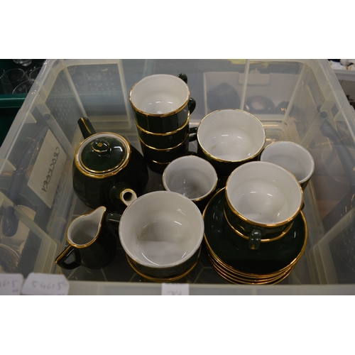 701 - A large quantity of Apilco green and gilt china.