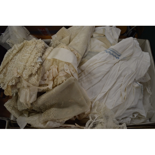 707 - A group of Christening dresses, feather fans etc.