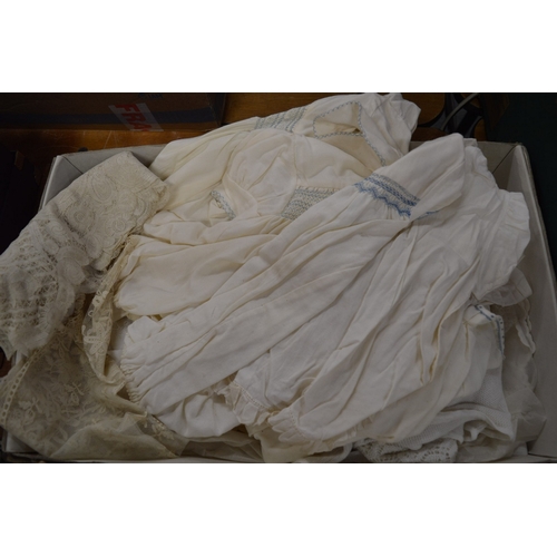 707 - A group of Christening dresses, feather fans etc.