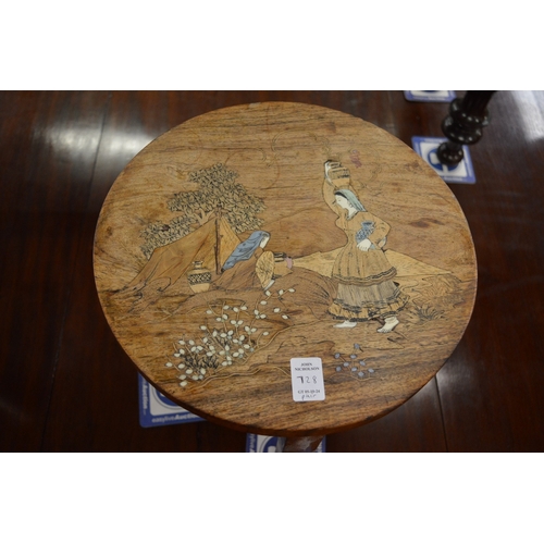 728 - A pair of small inlaid Indian hardwood circular folding tables.