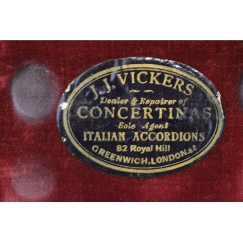 765 - A good concertina housed in its original J J Vickers box.