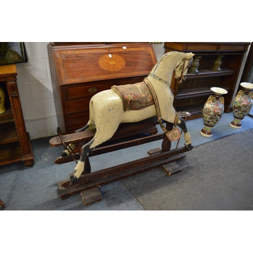 785 - An early rocking horse on stand.