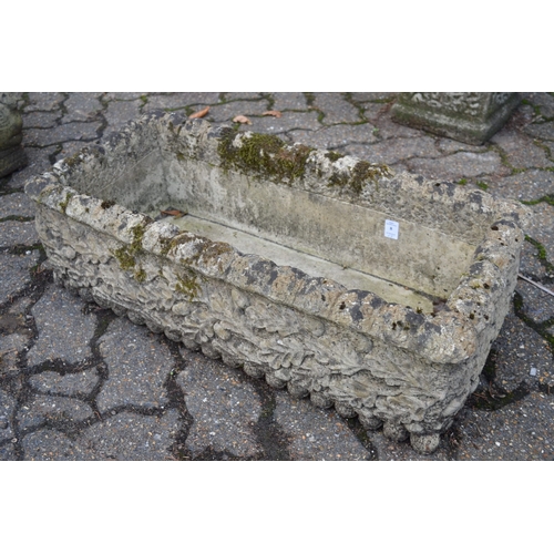 8 - A pair of reconstituted stone garden troughs and a similar trough.