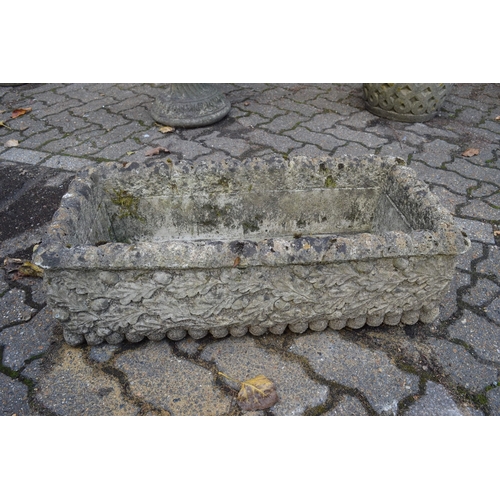 8 - A pair of reconstituted stone garden troughs and a similar trough.