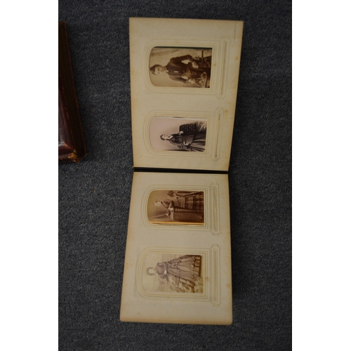 859 - Two Victorian embossed leather photograph albums with contents.